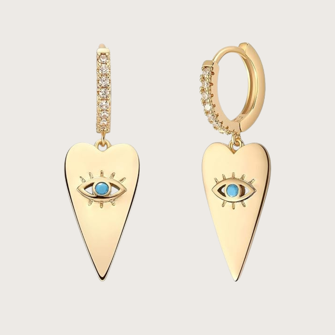 Gold heart-shaped earrings with eye design 