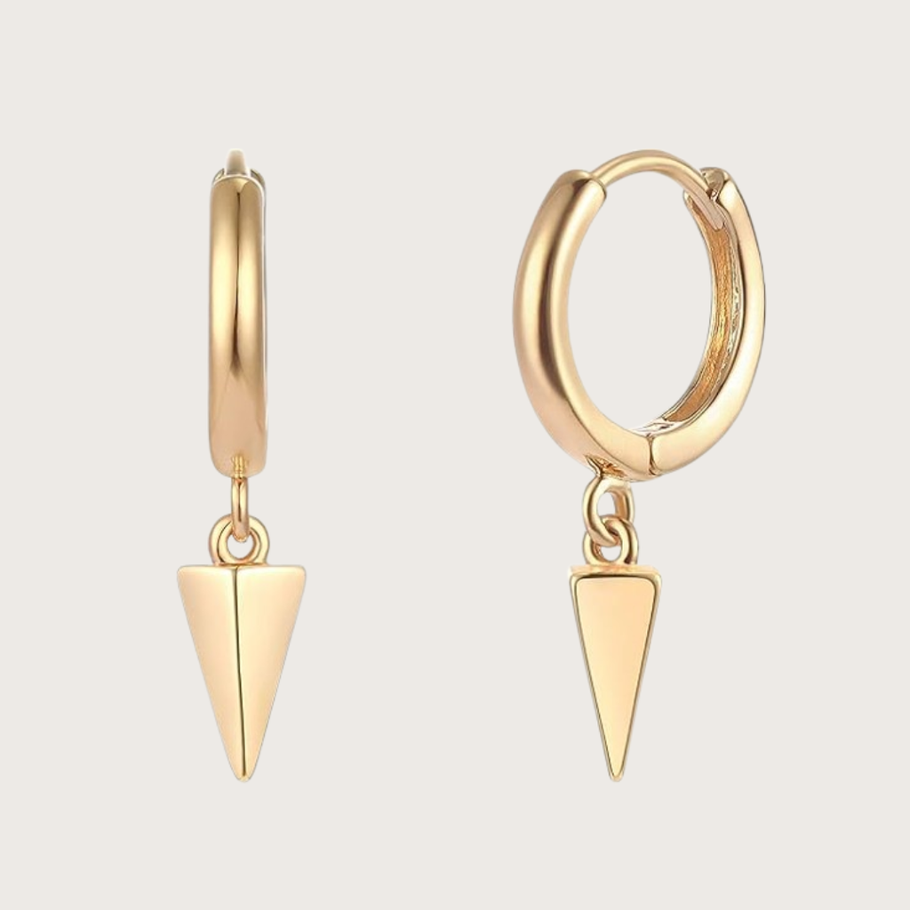 Gold hoop earrings with triangle pendants on a light gray background
