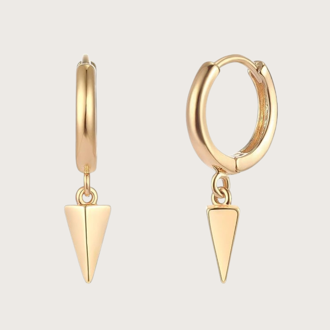 Gold hoop earrings with triangle pendants on a light gray background